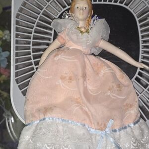 Vintage Porcelain Doll with Peach Dress